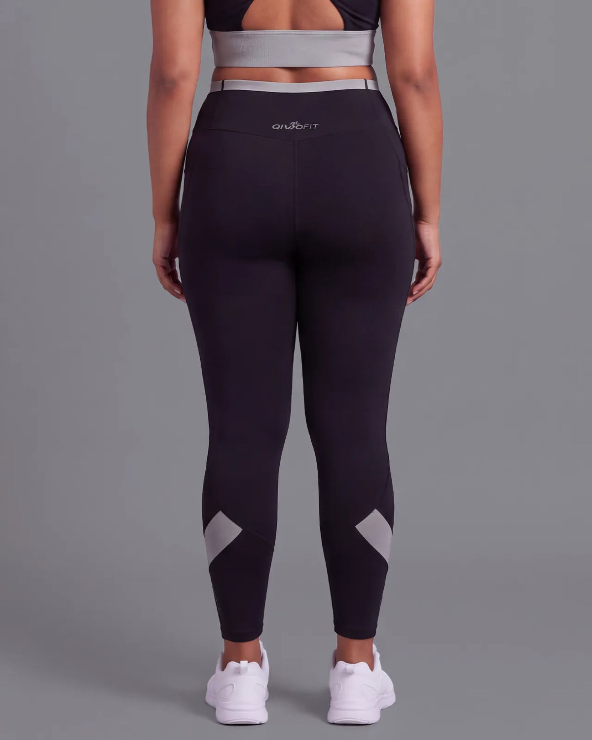Back view of Black High-Rise Leggings, showing the fit through the hips and seat.