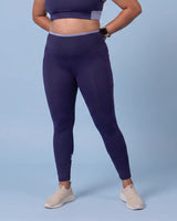Front view of Navy High-Rise Leggings with no front seam, a light blue waistband and calf panels.